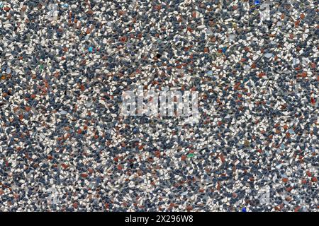 Colored Stone Plaster Texture: White-Blue-Red Variegated Stone Plaster Closeup Stock Photo
