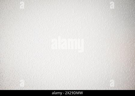 white painted woodchip wallpaper texture pattern backgroung. Stock Photo