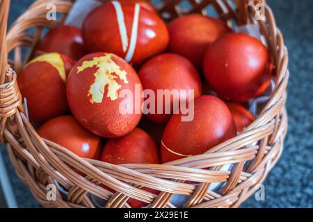 Close up of colorful Easter eggs in a basket. Stock Photo