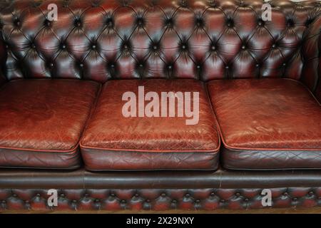Fragment of an old leather sofa Stock Photo