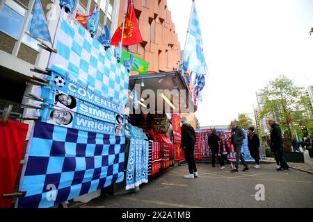 A street vendor sells merchandise ahead of the Emirates FA Cup semi-final match at Wembley Stadium, London. Picture date: Sunday April 21, 2024. Stock Photo