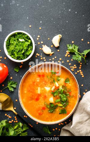 Lentil soup. Red lentil soup, traditional middle eastern food. Top view, vertical image. Stock Photo