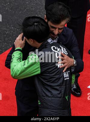 Shanghai, China. 21st Apr, 2024. Kick Sauber's Chinese driver Zhou Guanyu (front) hugs FIA President Mohammed Ben Sulayem before the Chinese Formula One Grand Prix race at the Shanghai International Circuit in Shanghai, China, on April 21, 2024. Credit: Xia Yifang/Xinhua/Alamy Live News Stock Photo