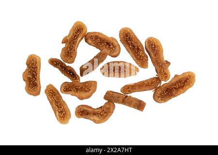 heap of dried figs fruit isolated on white background with clipping path, figs cut into pieces, top view Stock Photo