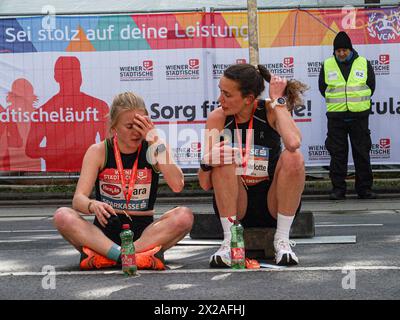 Vienna, Austria, Austria. 21st Apr, 2024. Two women sit and talk after finishing the 41st Vienna half marathon which took place today attracting an estimated 41,000 runners from 110 countries. (Credit Image: © Bianca Otero/ZUMA Press Wire) EDITORIAL USAGE ONLY! Not for Commercial USAGE! Credit: ZUMA Press, Inc./17�Թ����� Live News Stock Photo
