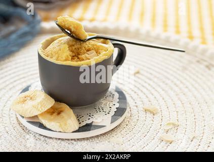 mini cake. Breakfast in a mug. homemade Portioned Banana mugcake in small mugs. Stock Photo