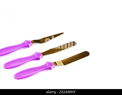 Professional Offset Spatula Set for icing large cakes quickly.  Stock Photo