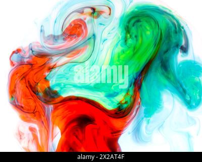 liquid paints in slow blending flow. Beautiful abstraction of liquid paints. Stock Photo