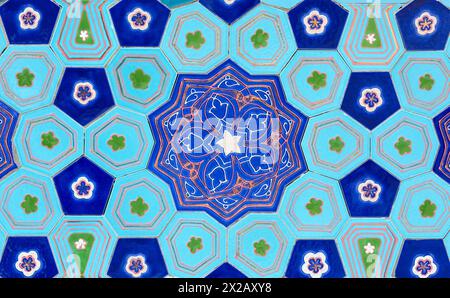 traditional Uzbek pattern on the ceramic tile on the wall of the mosque, background Stock Photo
