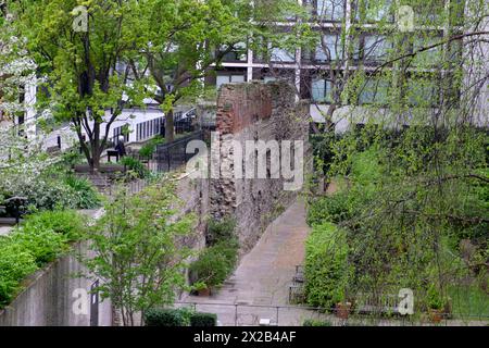 View of section of Roman London Wall archaeology at Salter Garden in April spring in the City of London England UK  KATHY DEWITT Stock Photo