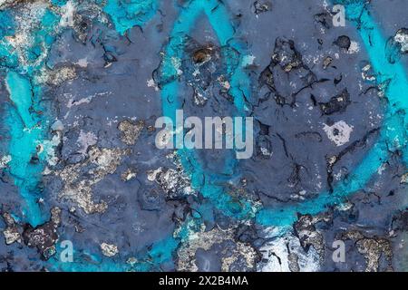 Dark teal abstract drawing on plastered old and all cracked wall. Stock Photo