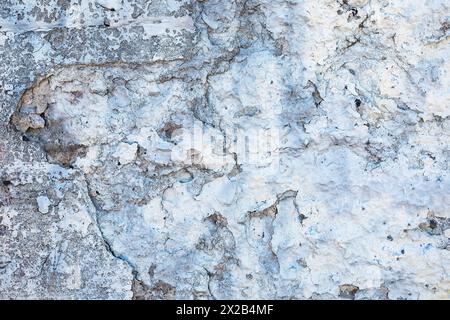 Glacier textures old plastered concrete wall with cracked and fallen paint, for background. Stock Photo