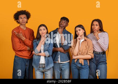 Group of five young people posing thoughtfully Stock Photo