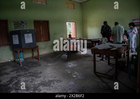 BOKAKHAT, INDIA, APRIL 19: Voters at a polling station to cast their votes during the first phase of the India's general elections on April 19, 2024 i Stock Photo