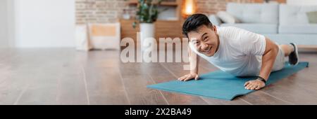 Strong asian mature man making strength workout Stock Photo