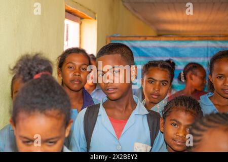 Miandrivazo, Madagascar 20 october 2023. Happy Malagasy school children in classroom. schoolchildren smile and look at teacher. There are many childre Stock Photo