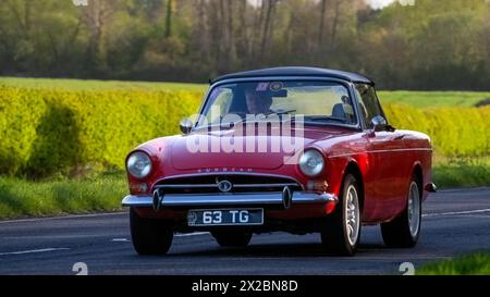 Bicester,UK- Apr 21st2024: 1965 red Sunbeam Tiger classic car driving on a British road Stock Photo