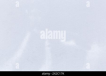 Front view of a clean and blank plastered wall painted in white. Abstract high resolution full frame textured background with copy space. Stock Photo