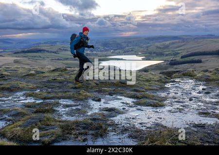 Alex Payne crosses Standedge during the 2024 winter Spine Race Stock Photo