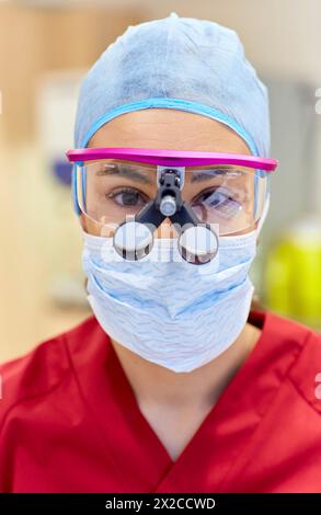 Surgeon with magnifying glasses. Surgical glasses. Plastic surgery. Stock Photo