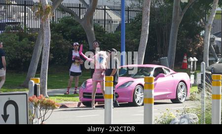 West Hollywood, California, USA 21st April 2024 Angelyne wearing a mask with her Pink Corvette at her Billboard on Santa Monica Blvd on April 21, 2024 in West Hollywood, California, USA. Photo by Barry King/Alamy Stock Photo Stock Photo