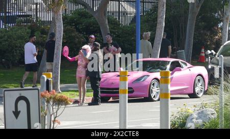 West Hollywood, California, USA 21st April 2024 Angelyne wearing a mask with her Pink Corvette taking phots of her Billboard on Santa Monica Blvd on April 21, 2024 in West Hollywood, California, USA. Photo by Barry King/Alamy Stock Photo Stock Photo