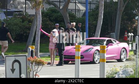 West Hollywood, California, USA 21st April 2024 Angelyne wearing a mask with her Pink Corvette taking phots of her Billboard on Santa Monica Blvd on April 21, 2024 in West Hollywood, California, USA. Photo by Barry King/Alamy Stock Photo Stock Photo