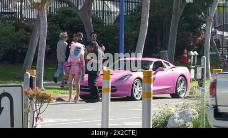 West Hollywood, California, USA 21st April 2024 Angelyne wearing a mask with her Pink Corvette at her Billboard on Santa Monica Blvd on April 21, 2024 in West Hollywood, California, USA. Photo by Barry King/Alamy Stock Photo Stock Photo