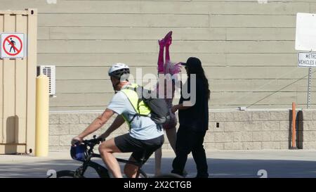 West Hollywood, California, USA 21st April 2024 Angelyne wearing a mask with her Pink Corvette taking phots of her Billboard on Santa Monica Blvd on April 21, 2024 in West Hollywood, California, USA. Photo by Barry King/Alamy Stock Photo Stock Photo