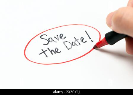 Hand writing text save the date with red marker pen Stock Photo
