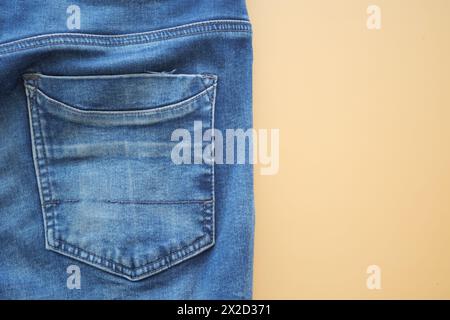 man jeans on a bright yellow background with copy space. Stock Photo