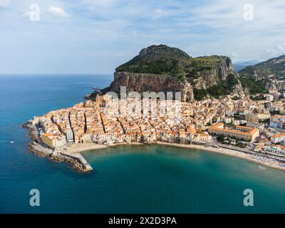 Cefalu, Italy: Aerial panorama of famous Cefalu old town with its Norman mediveval cathedral and cliff in Sicily, Italy. The town is a very popular su Stock Photo