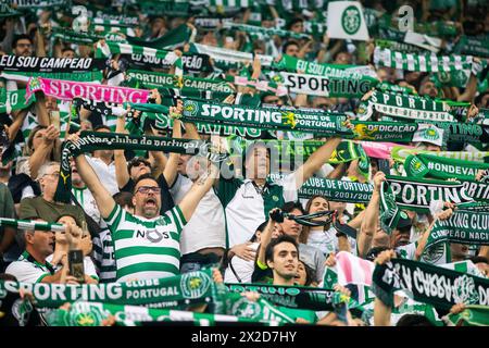 Lisbon, Portugal. 21st Apr, 2024. Sporting CP supporters hold scarves during the Liga Portugal Betclic football match between Sporting CP and Vitoria SC at Alvalade Stadium. (Final score: Sporting CP 3 - 0 Vitoria SC) Credit: SOPA Images Limited/Alamy Live News Stock Photo