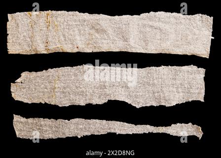 Pieces of torn paper on black background Stock Photo