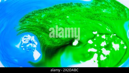 liquid paints in slow blending flow. Beautiful abstraction of liquid paints Stock Photo