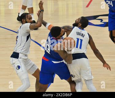 Los Angeles, Unite States. 21st Apr, 2024. Dallas Mavericks guard Kyrie Irving (11) fouls Los Angeles Clippers forward Paul George (13) during the first half in Game 1 of their Western Conference first-round playoff series at Crypto.com Arena in Los Angeles on Sunday, April 22, 2024. Photo by Jim Ruymen/UPI Credit: UPI/Alamy Live News Stock Photo