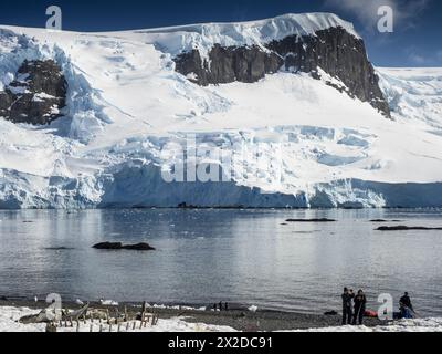 tourists on D’Hainaut Island, Mikkelsen Harbour, Trinity Island, Palmer Archipelago, Antarctica Stock Photo