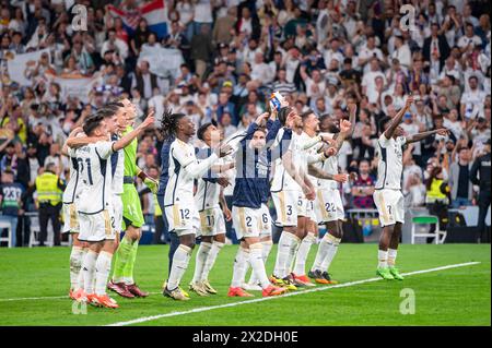 Madrid, Spain. 21st Apr, 2024. Real Madrid players (from L to R) Brahim Diaz, Kepa Arrizabalaga, Andriy Lunin, Ferland Mendy, Eduardo Camavinga, Daniel Carvajal, Eder Militao, Jude Bellingham, Vinicius Junior seen celebrating the victory at the end of the La Liga EA Sports 2023/24 football match between Real Madrid vs FC Barcelona at Estadio Santiago Bernabeu. Real Madrid 3 : 2 FC Barcelona Credit: SOPA Images Limited/Alamy Live News Stock Photo