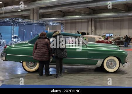 People Watching Green Cadillac Convertible Coupe 62 series Produced in 1948. Stock Photo