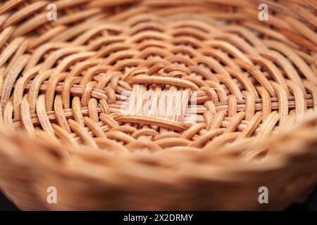 Textured pattern of empty handcraft rattan wicker bowl close up Stock Photo