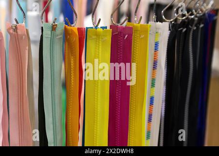 Multicolored Zippers or Zip Fasteners used for binding fabric or textile Stock Photo