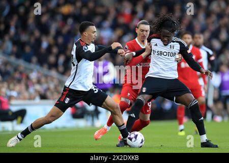 Antonee Robinson of Fulham and Calvin Bassey of Fulham fend off Darwin Núñez of Liverpool during the Premier League match between Fulham and Liverpool at Craven Cottage, London, England on 21 April 2024. Photo by Carlton Myrie. Editorial use only, license required for commercial use. No use in betting, games or a single club/league/player publications. Stock Photo