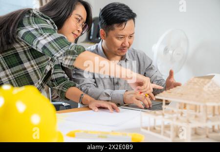 Two architects are working together in the office Stock Photo