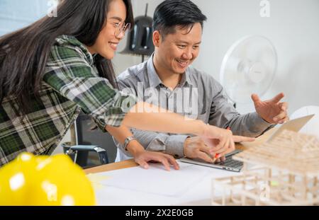 Two architects are working together in the office Stock Photo