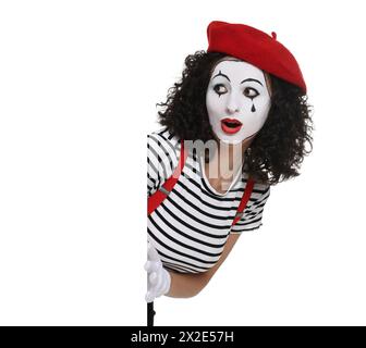 Funny mime with blank poster posing on white background Stock Photo