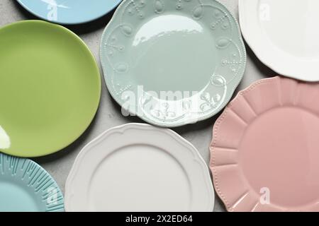 Beautiful ceramic plates on light grey table, flat lay Stock Photo