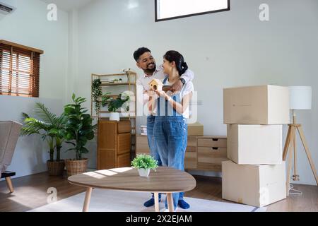Married couple moving in new property bought together on mortgage loan Stock Photo