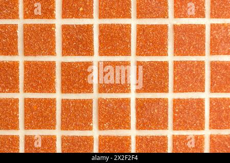 mosaic background of ceramic tiles on the wall or on the floor. Geometric pattern with mesh texture for pool, wall or floor decoration. A simple abstr Stock Photo