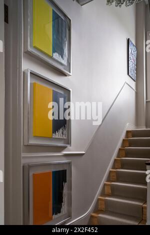 Framed modern artwork in hallway of Georgian townhouse, Paultons Square, Chelsea, London, UK. Stock Photo