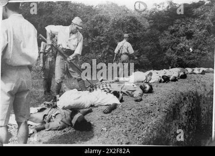 ATROCITIES CARRIED OUT BY JAPANESE FORCES DURING THE SECOND WORLD WAR - Japanese soldier bayonetting one of the executed Sikh prisoners , Stock Photo